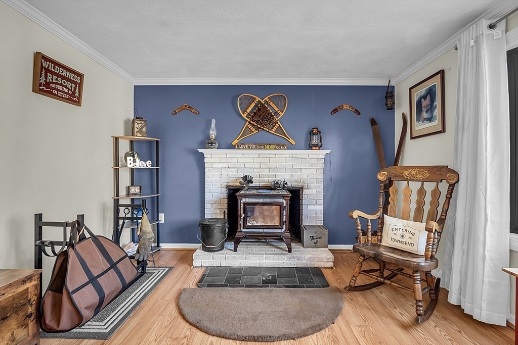 24 Edward Road Townsend, MA 01469 - Photo 7 of 38 a living room with furniture and a fireplace