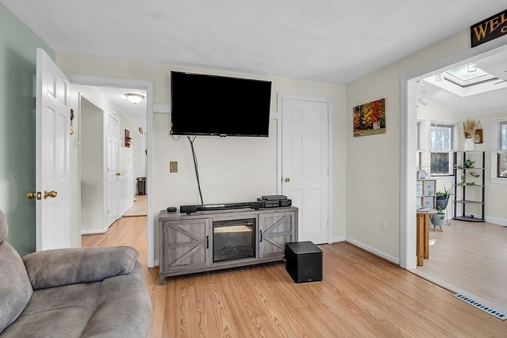 24 Edward Road Townsend, MA 01469 - Photo 9 of 38 a living room with furniture and a flat screen tv