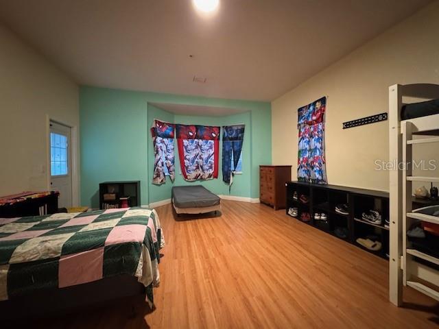 12140 Murray Avenue Largo, FL 33778 - Photo 11 of 23 a living room with furniture and a flat screen tv