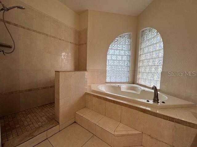 12140 Murray Avenue Largo, FL 33778 - Photo 13 of 23 a bathroom with a bathtub and a sink