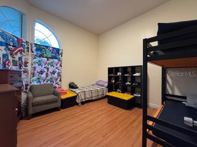 12140 Murray Avenue Largo, FL 33778 - Photo 15 of 23 a bedroom with furniture and window