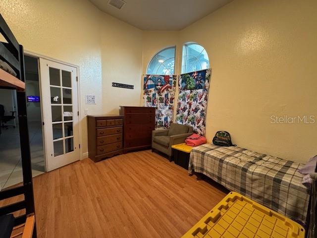 12140 Murray Avenue Largo, FL 33778 - Photo 16 of 23 a bed room with a bed and a television