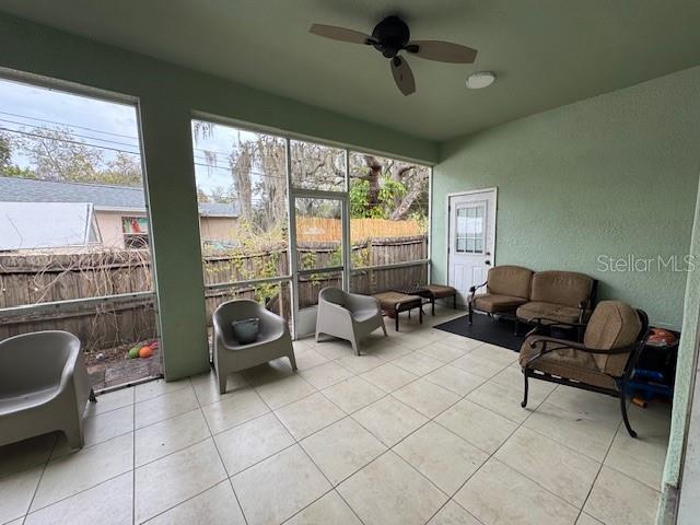 12140 Murray Avenue Largo, FL 33778 - Photo 5 of 23 a living room with furniture and a floor to ceiling window