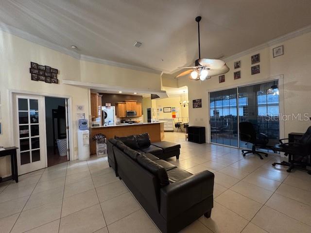 12140 Murray Avenue Largo, FL 33778 - Photo 7 of 23 a living room with furniture a dining table and chairs