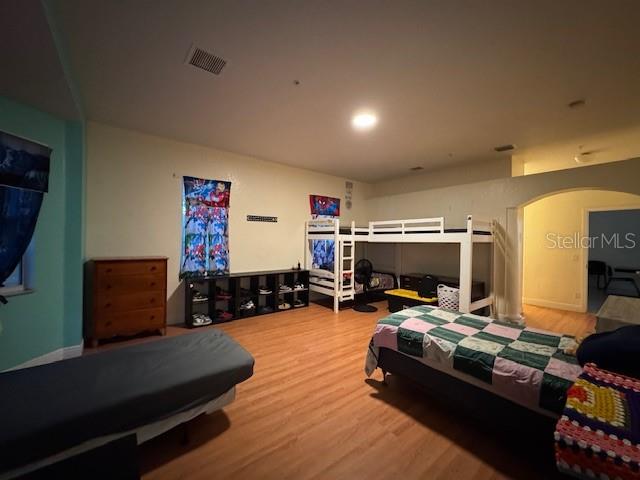 12140 Murray Avenue Largo, FL 33778 - Photo 10 of 23 a living room with furniture gym equipment and a flat screen tv