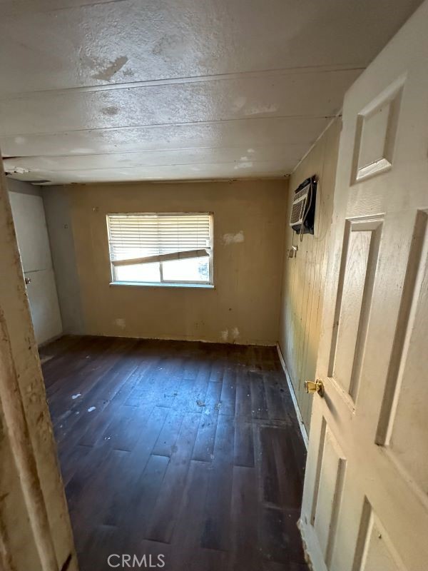 1070 Katherine Road Simi Valley, CA 93063 - Photo 12 of 17 a view of an empty room with wooden floor and a window