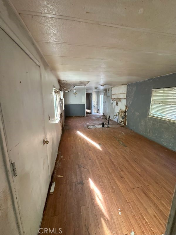 1070 Katherine Road Simi Valley, CA 93063 - Photo 8 of 17 a view of a hallway with wooden floor and door