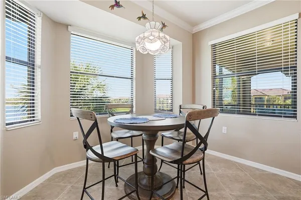 a dining room with furniture and window