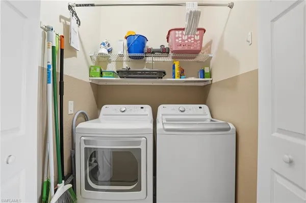 a utility room with dryer and washer