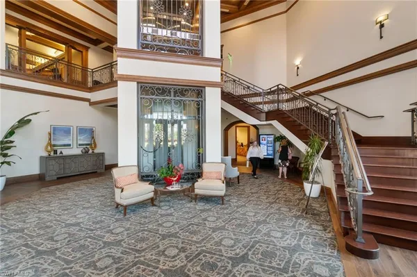 a living room with furniture and a painting on the wall
