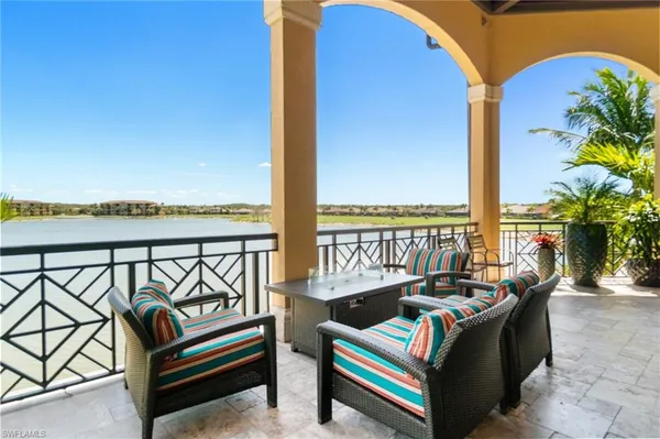 a balcony with furniture and city view
