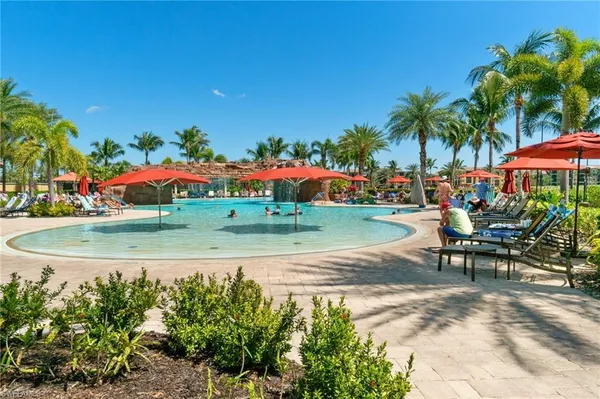 an outdoor space with furniture and umbrella