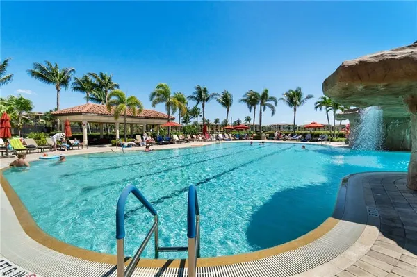 a view of swimming pool and outdoor seating