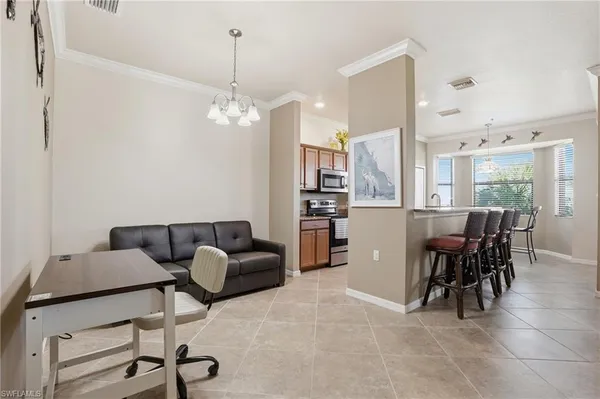 a livingroom with furniture and a dining table