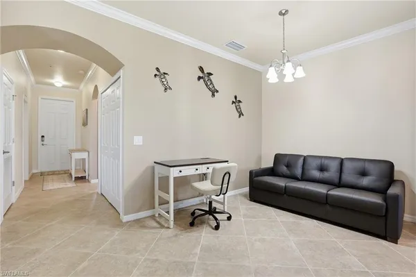 a view of a livingroom with a couch and furniture