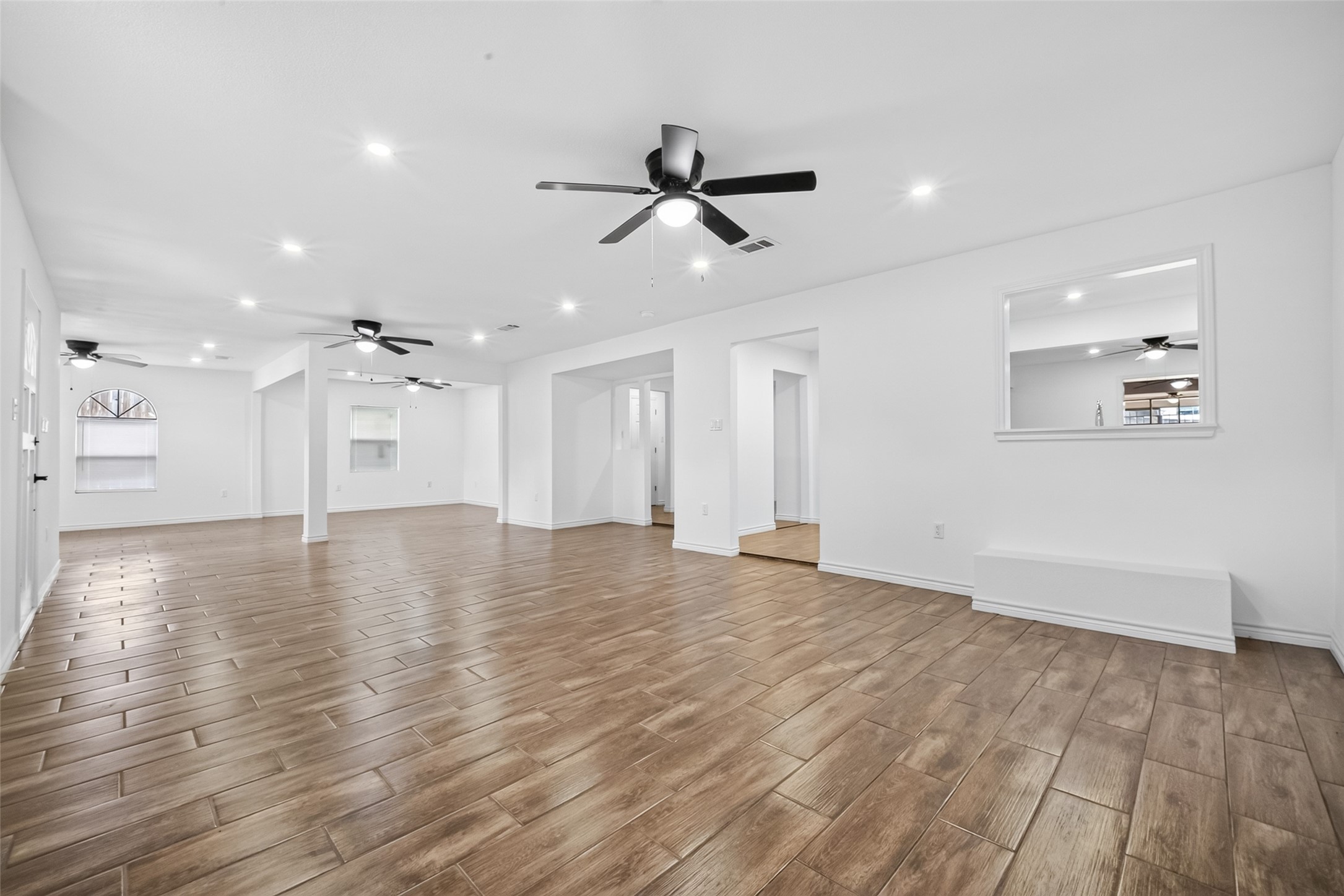 3530 Rosedale Street Houston, TX 77004 - Photo 6 of 50 Immaculate walls and sleek tiled floors create a modern, inviting atmosphere throughout.