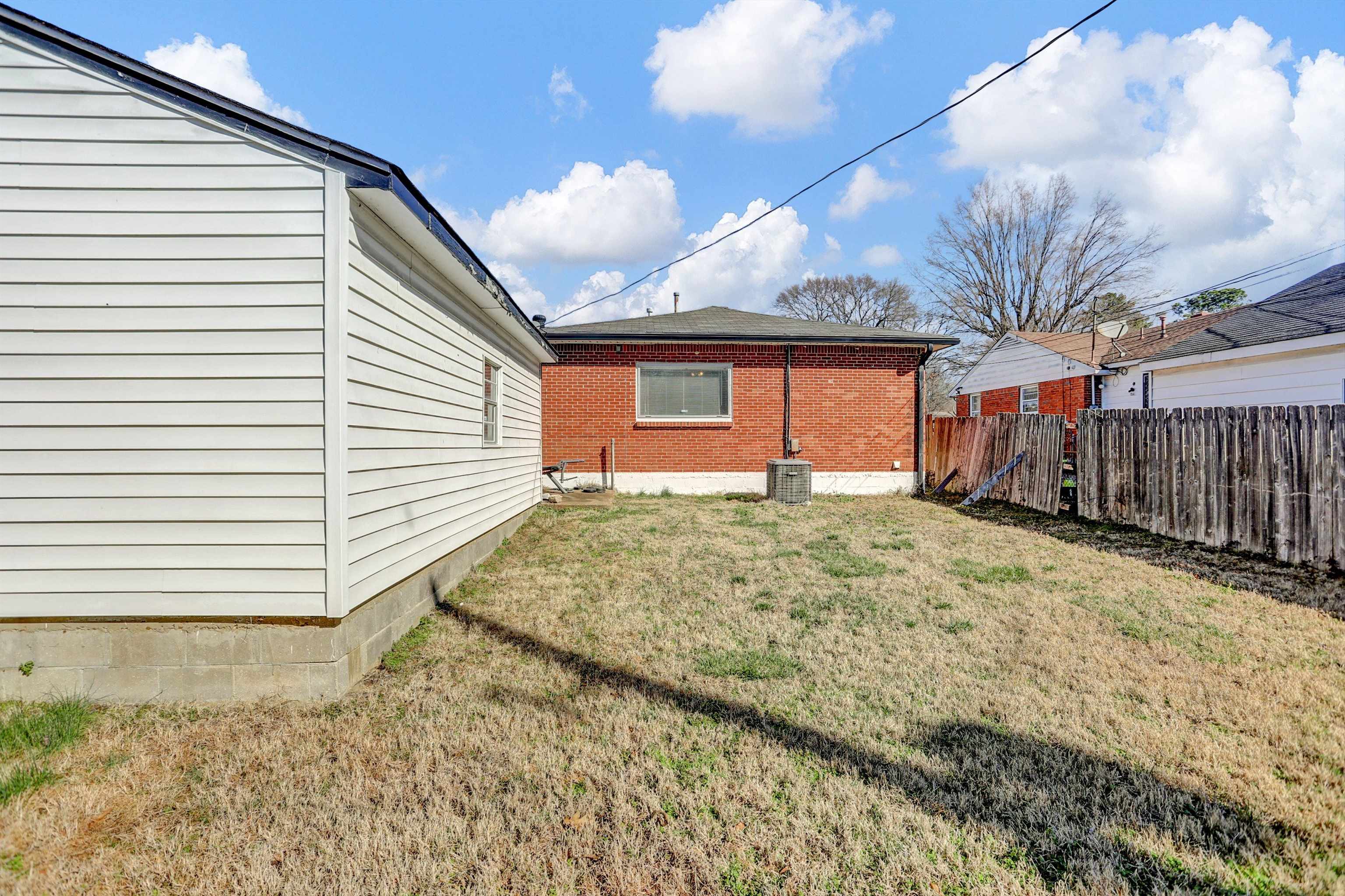 4931 Owen Road Memphis, TN 38122 - Photo 20 of 24 View of yard featuring cooling unit and fence
