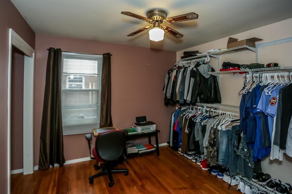4931 Owen Road Memphis, TN 38122 - Photo 22 of 24 Spacious closet featuring ceiling fan and wood finished floors