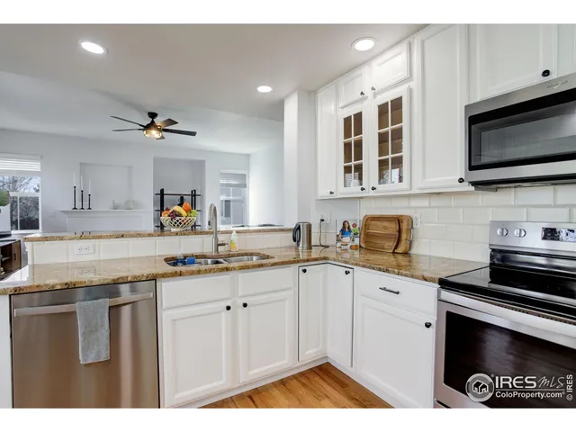 a kitchen with a sink stove and microwave
