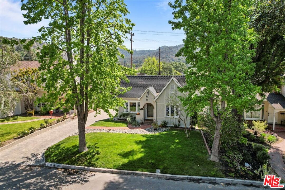 2400 Sylvan Lane Glendale, CA 91208 - Photo 2 of 28 a front view of a house with garden