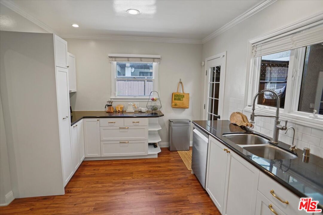 2400 Sylvan Lane Glendale, CA 91208 - Photo 8 of 28 a kitchen with sink cabinets and stove