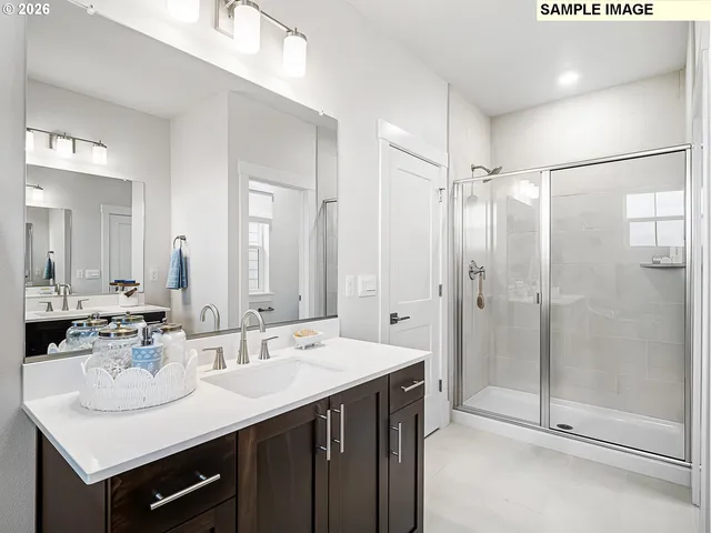 a bathroom with a sink double vanity and a mirror