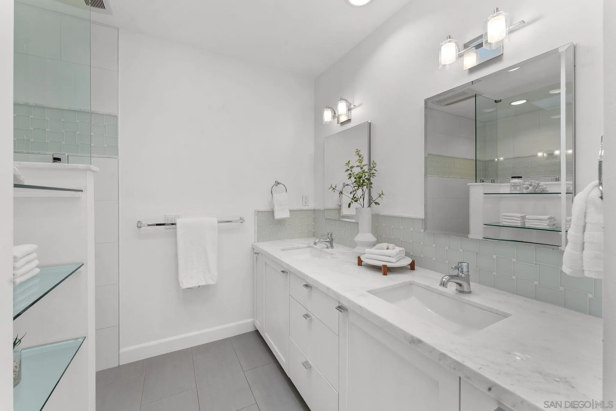 3127 Vista Rica Carlsbad, CA 92009 - Photo 12 of 25 a bathroom with a double vanity sink mirror and double