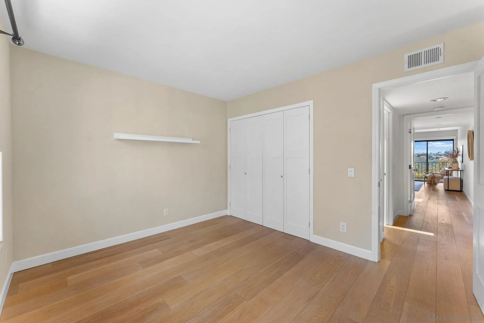 3127 Vista Rica Carlsbad, CA 92009 - Photo 19 of 25 a view of a room with wooden floor