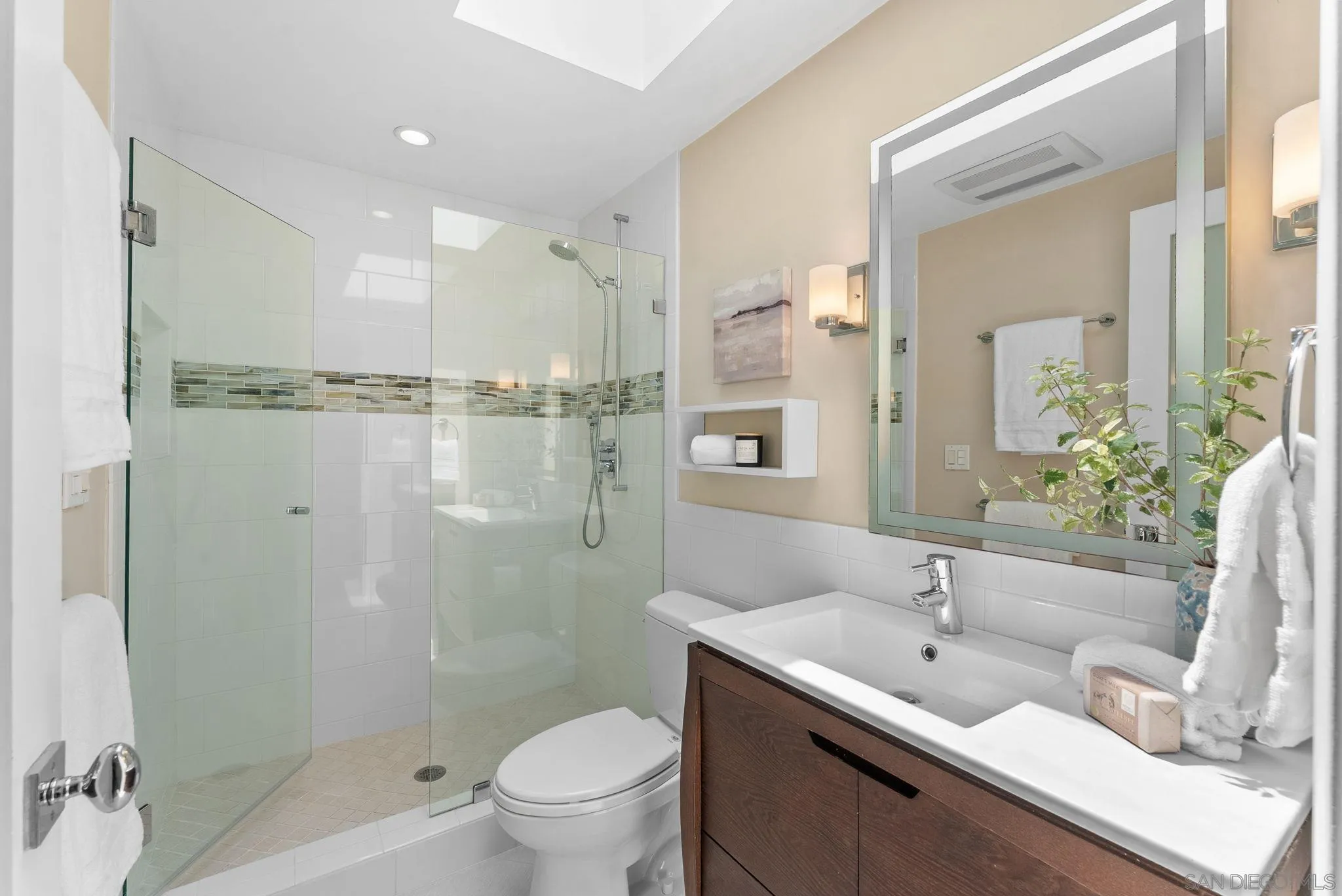 3127 Vista Rica Carlsbad, CA 92009 - Photo 20 of 25 a bathroom with a double vanity sink toilet and shower