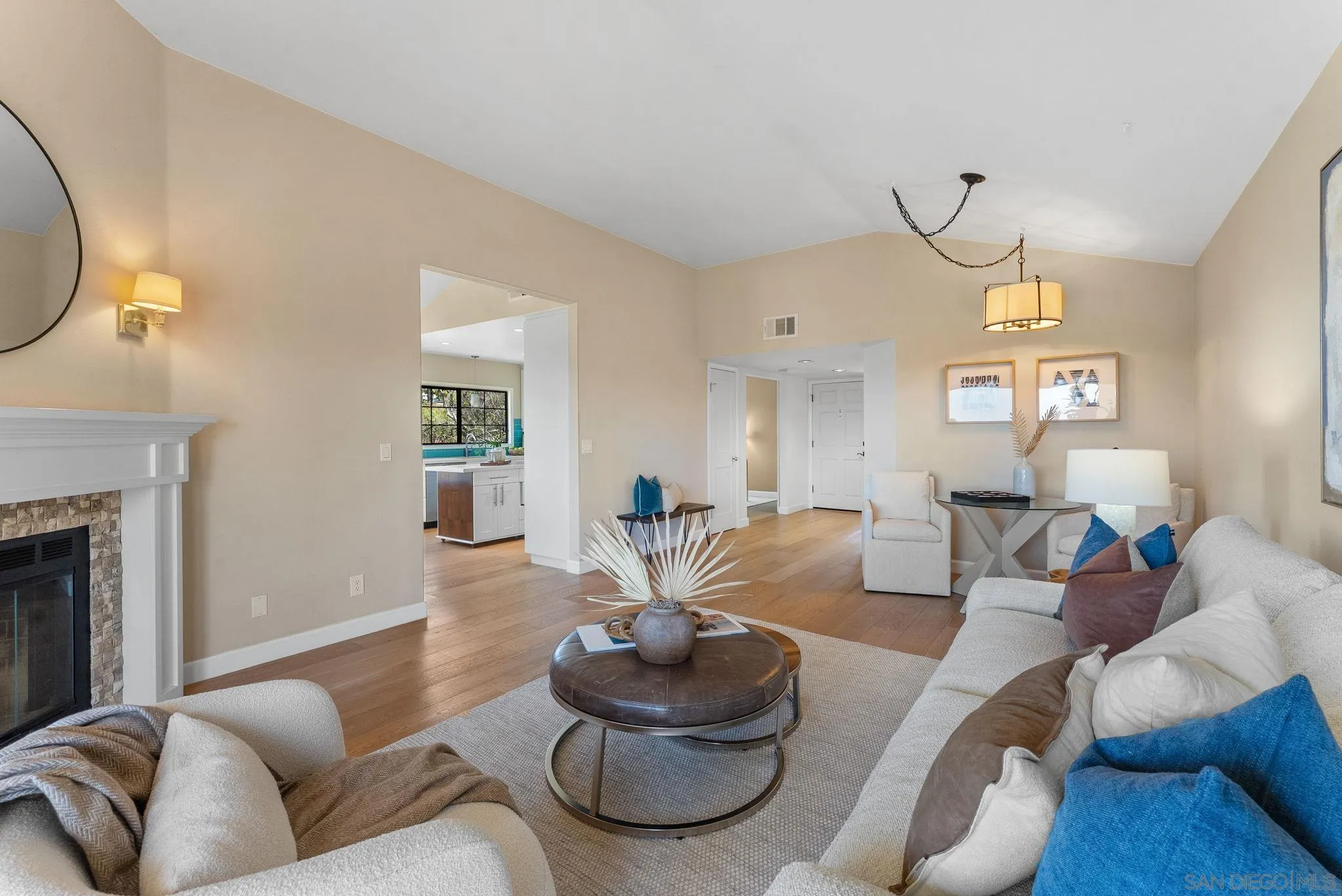 3127 Vista Rica Carlsbad, CA 92009 - Photo 5 of 25 a living room with furniture and a fireplace