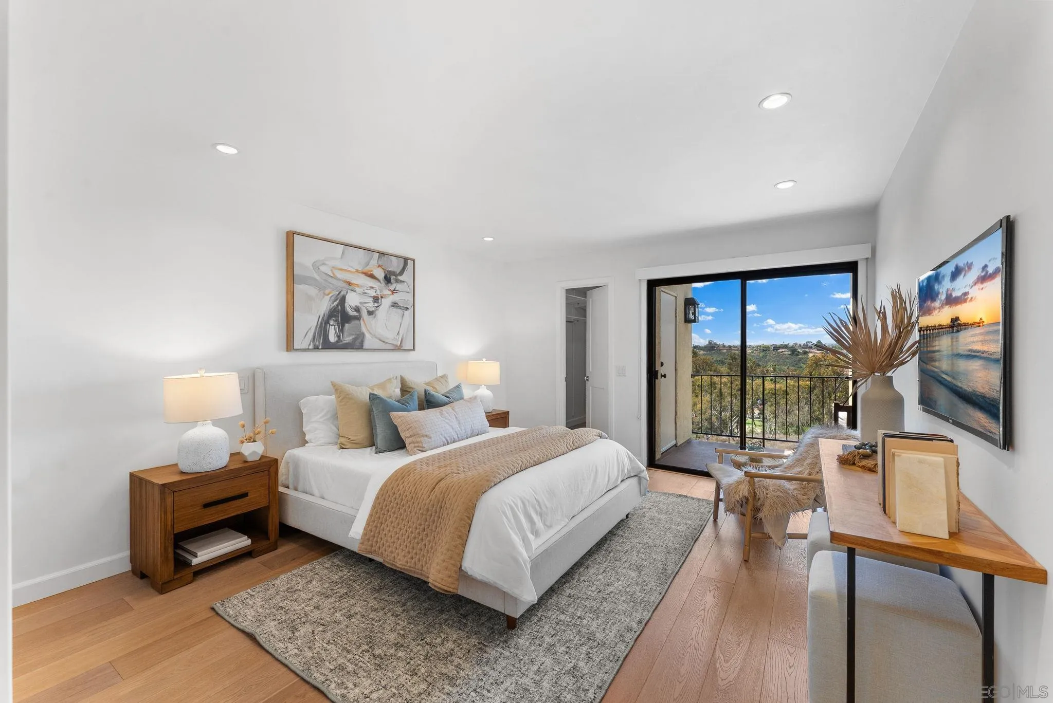 3127 Vista Rica Carlsbad, CA 92009 - Photo 10 of 25 a bedroom with bed table and flat screen tv