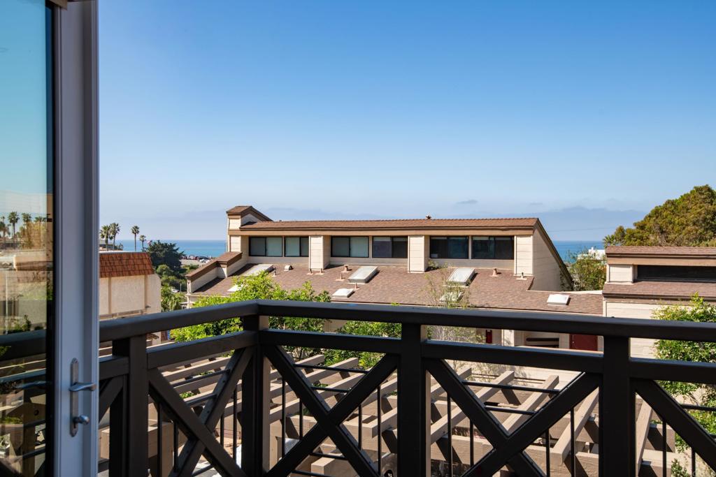 90 North Coast Highway 101, Unit 310 Encinitas, CA 92024 - Photo 10 of 24 a balcony view with two chairs and a table