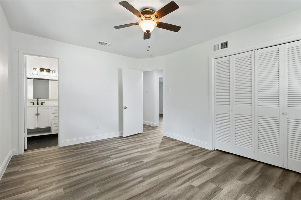 3126 Jubilee Trail Dallas, TX 75229 - Photo 17 of 38 a view of empty room with wooden floor and ceiling fan