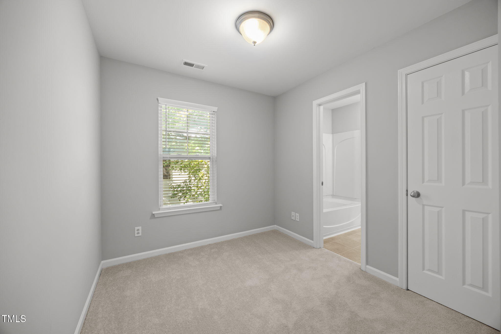 6626 Clarksburg Place Raleigh, NC 27616 - Photo 18 of 25 an empty room that has a window