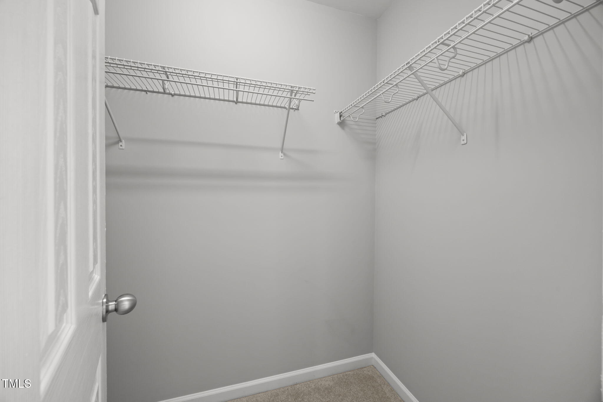 6626 Clarksburg Place Raleigh, NC 27616 - Photo 19 of 25 a view of a room with racks on the wall