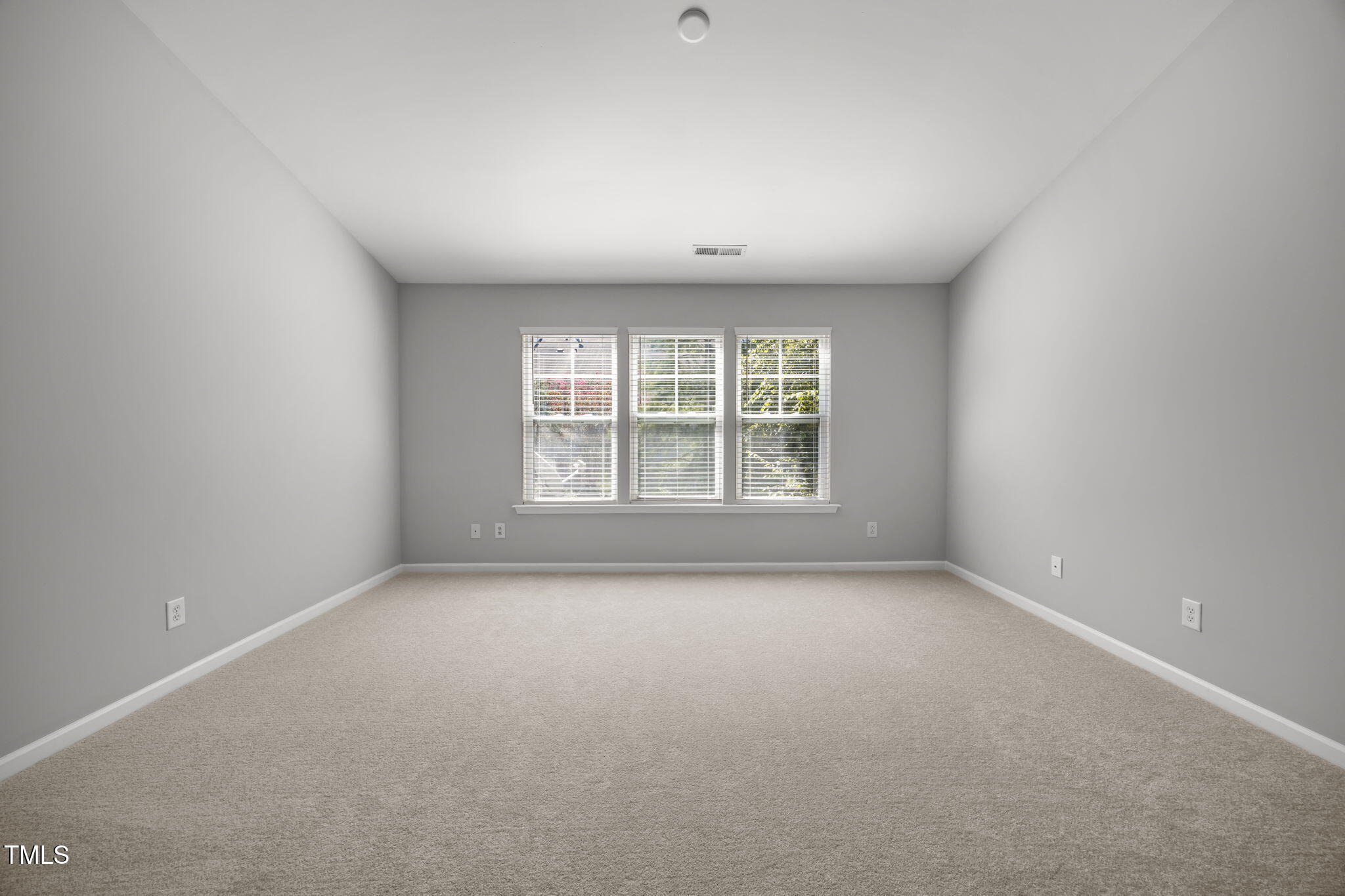 6626 Clarksburg Place Raleigh, NC 27616 - Photo 20 of 25 an empty room with windows