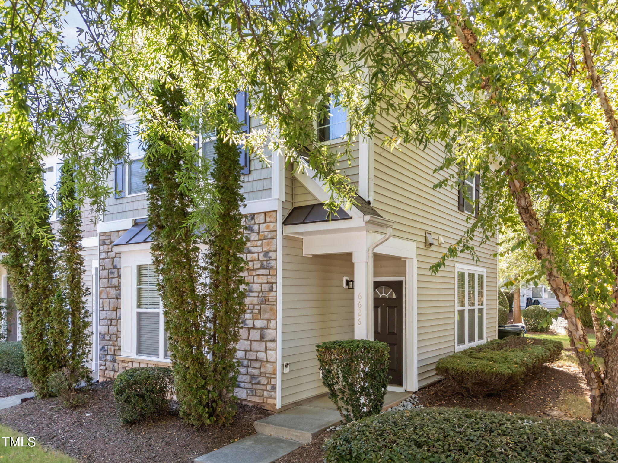 6626 Clarksburg Place Raleigh, NC 27616 - Photo 2 of 25 a view of a house with a yard and potted plants