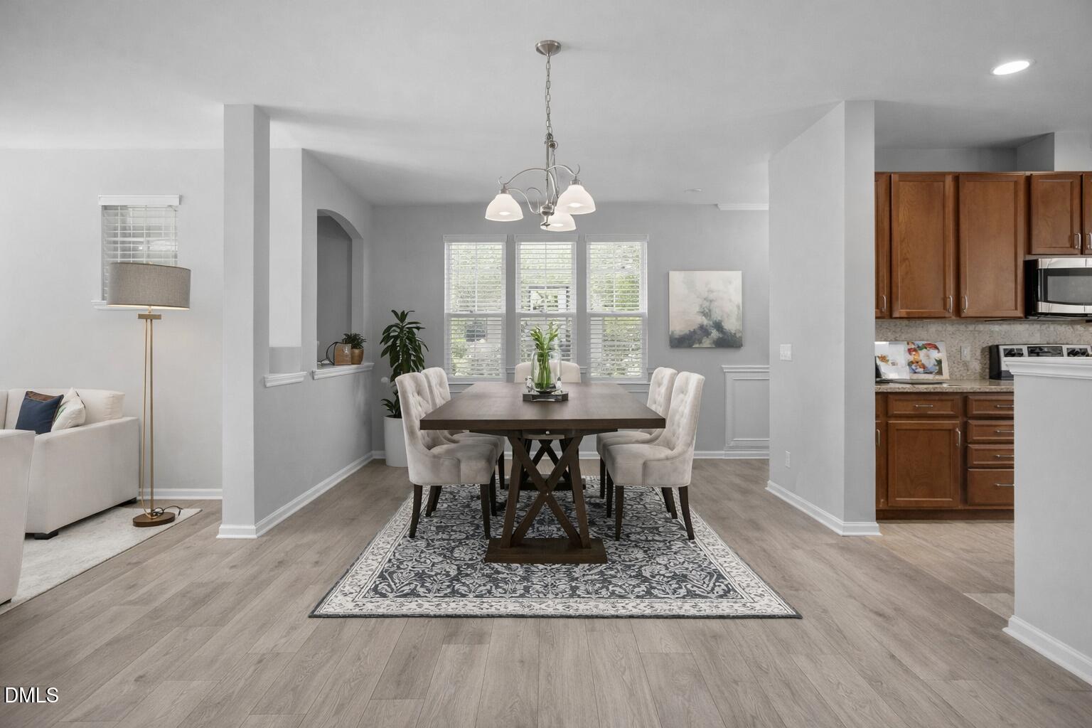 6626 Clarksburg Place Raleigh, NC 27616 - Photo 5 of 25 a view of a dining room with furniture window and wooden floor