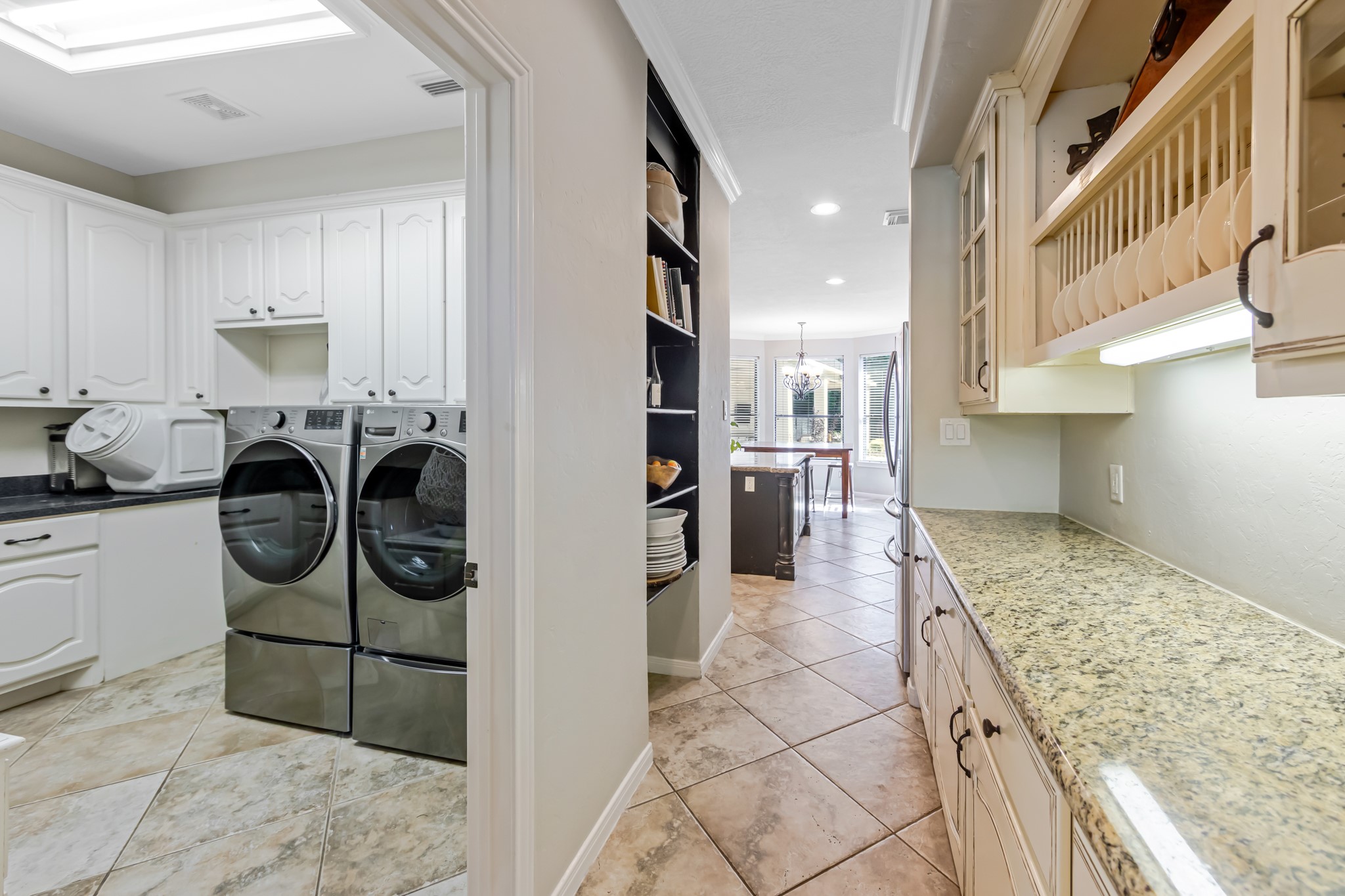 13303 Lost Creek Road Tomball, TX 77375 - Photo 35 of 50 a kitchen with refrigerator and stove