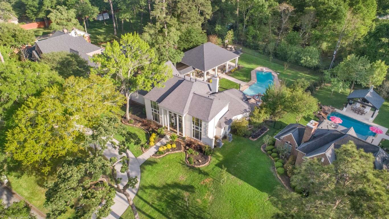 13303 Lost Creek Road Tomball, TX 77375 - Photo 9 of 50 an aerial view of house with yard swimming pool and outdoor seating