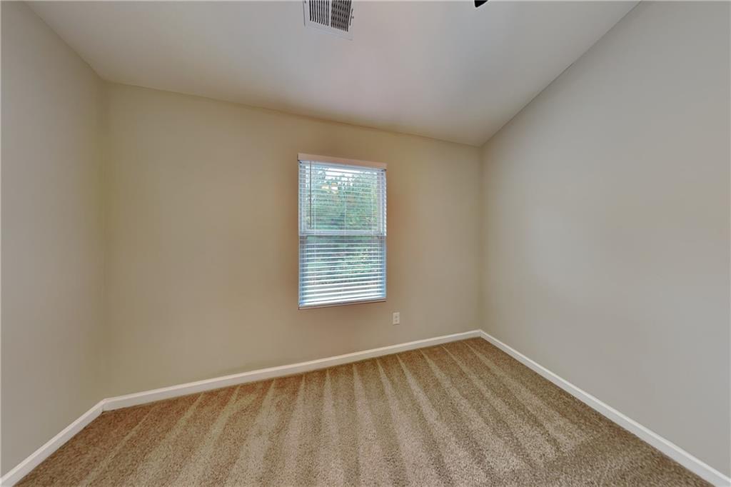 288 Stable View Loop Dallas, GA 30132 - Photo 13 of 19 a view of an empty room with a window