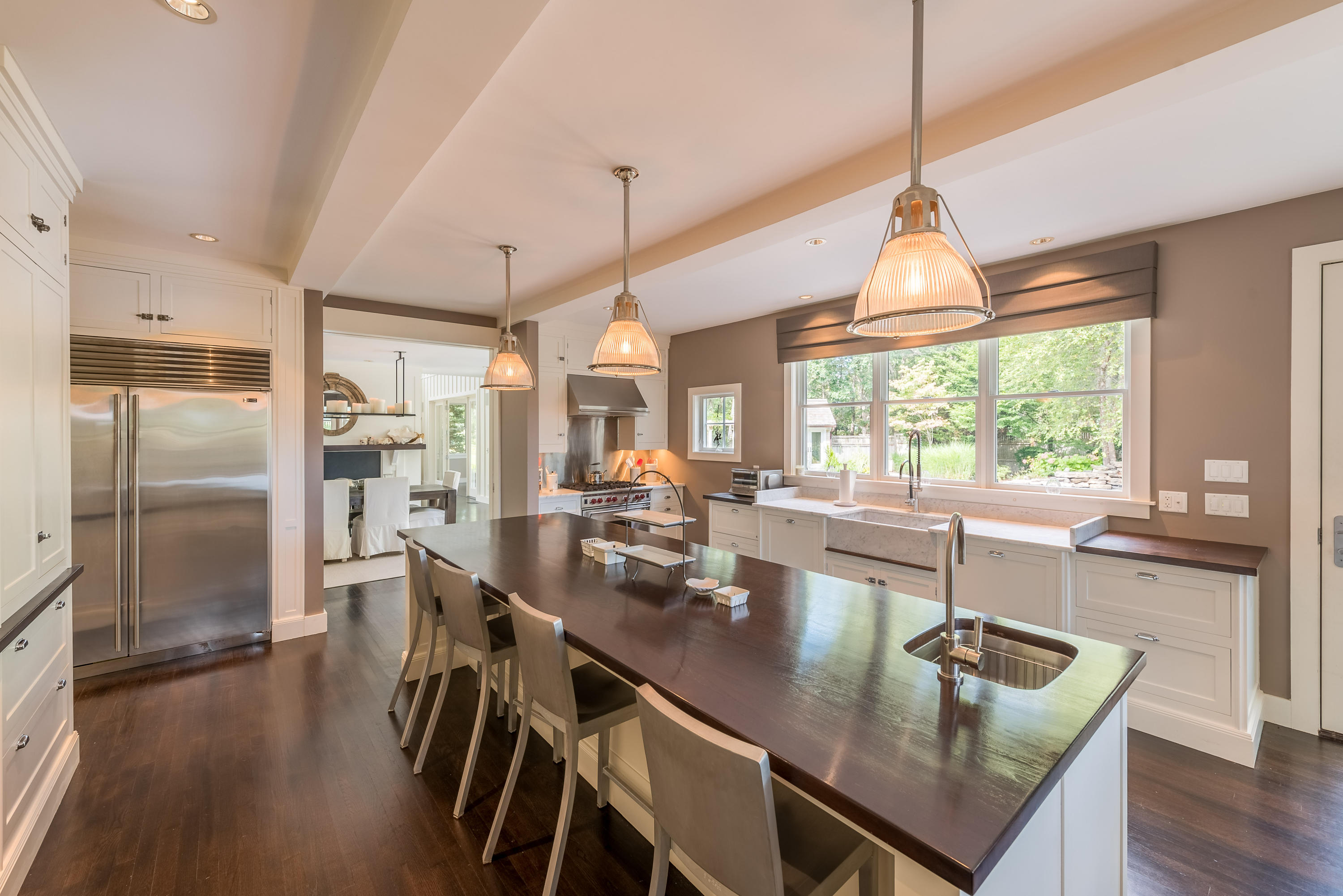 54 Gullane Road Mashpee, MA 02649 - Photo 4 of 25 a kitchen with stainless steel appliances granite countertop a stove a refrigerator a kitchen island a sink and chairs