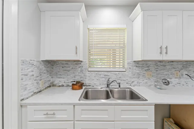 a view with a sink and cabinets