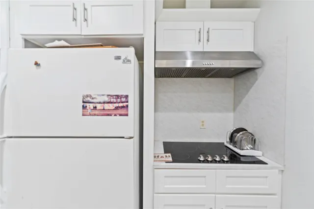a close view of a utility room with washer and dryer