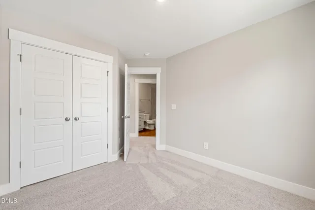 a view of a backyard with a large tree