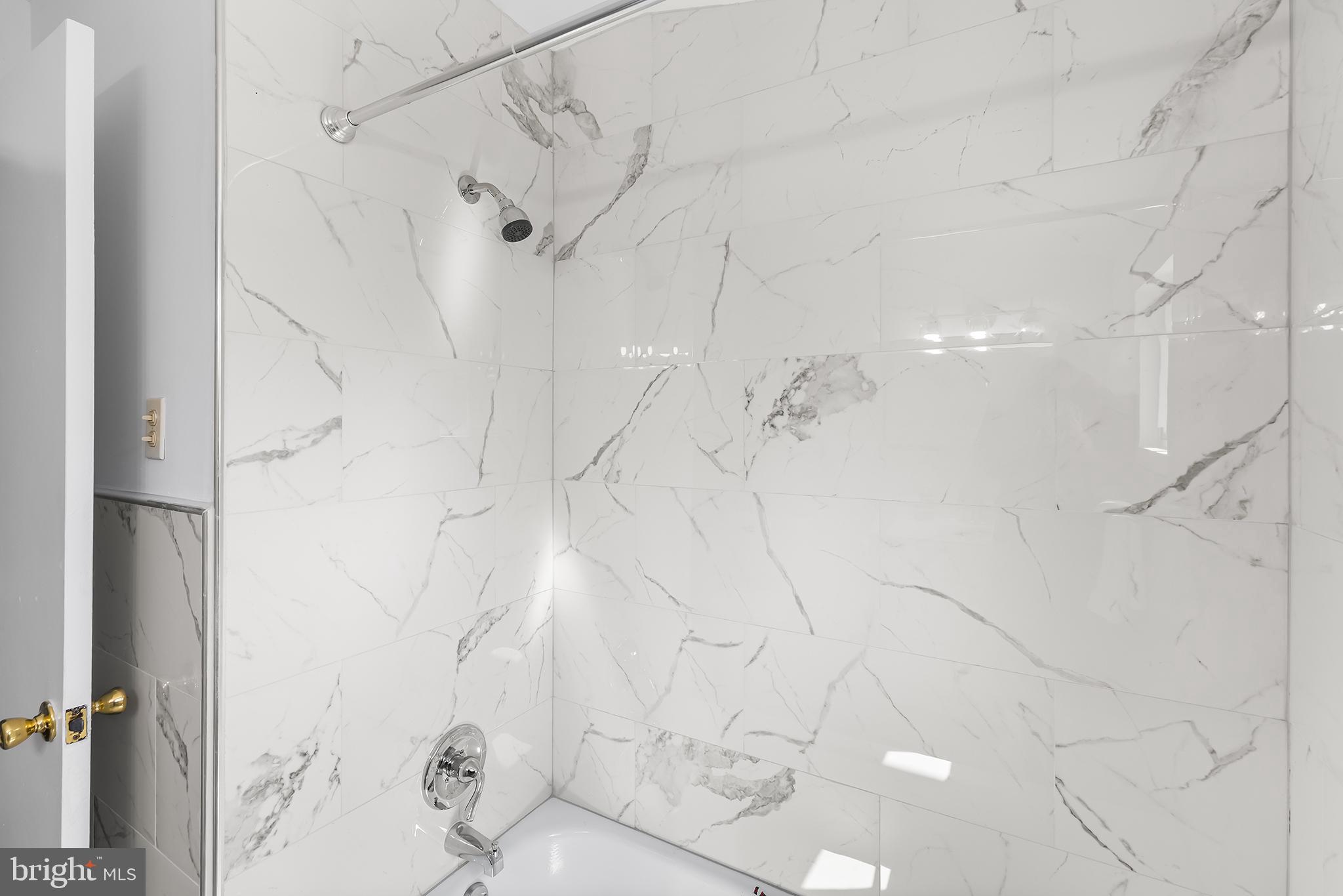 343 Sugartown Road, Unit B Wayne, PA 19087 - Photo 11 of 14 a bathroom with a shower