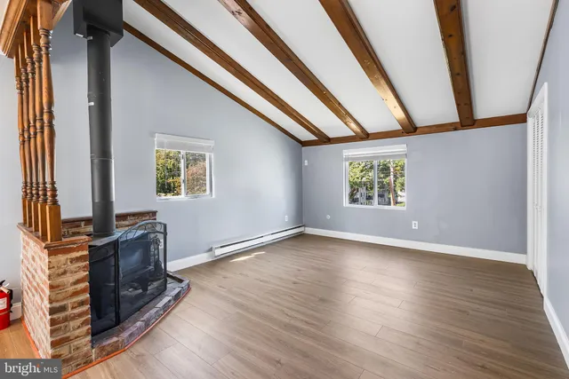 a view of kitchen with furniture and wooden floor