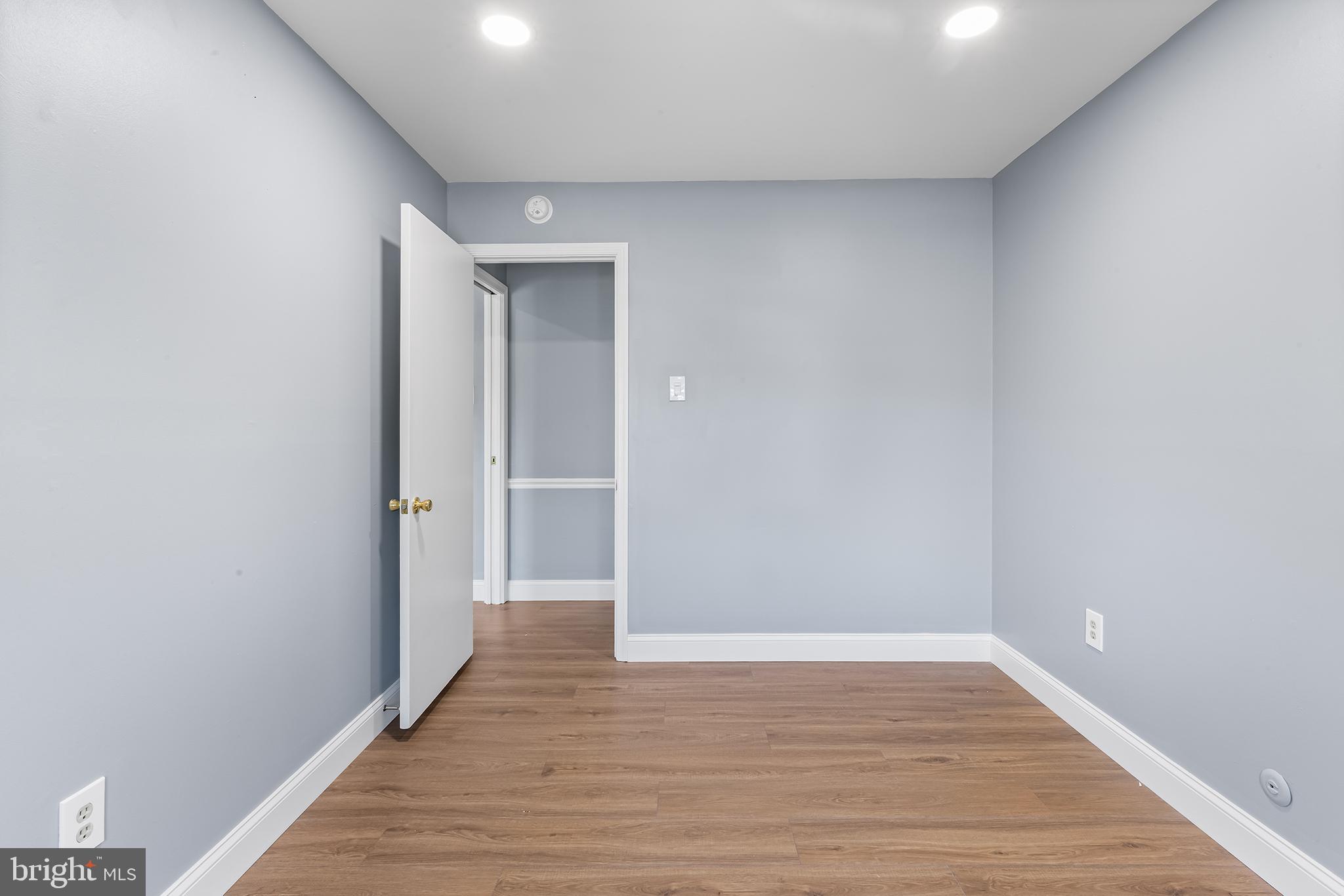 343 Sugartown Road, Unit B Wayne, PA 19087 - Photo 9 of 14 a view of an empty room with wooden floor