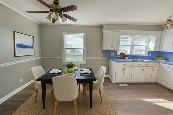 a view of a dining room with furniture and window