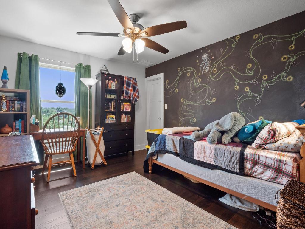10103 Twin Lake Loop Dripping Springs, TX 78620 - Photo 28 of 32 Bedroom featuring wood finished floors and ceiling fan